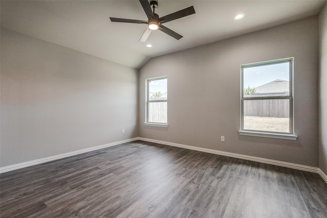 spare room featuring baseboards, dark wood finished floors, and recessed lighting