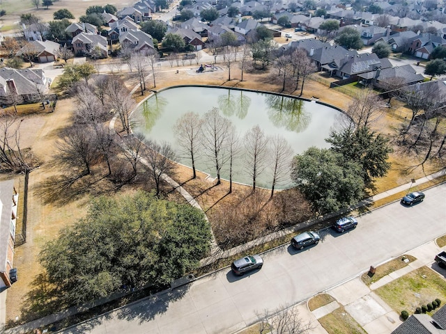 bird's eye view with a residential view and a water view