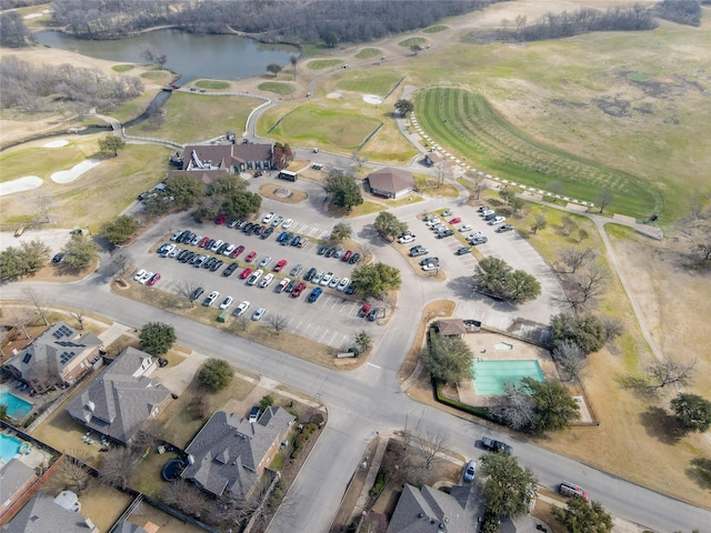 drone / aerial view featuring a water view and golf course view