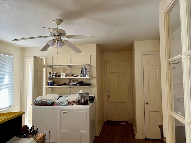 clothes washing area with dark wood-style floors, laundry area, independent washer and dryer, and a ceiling fan