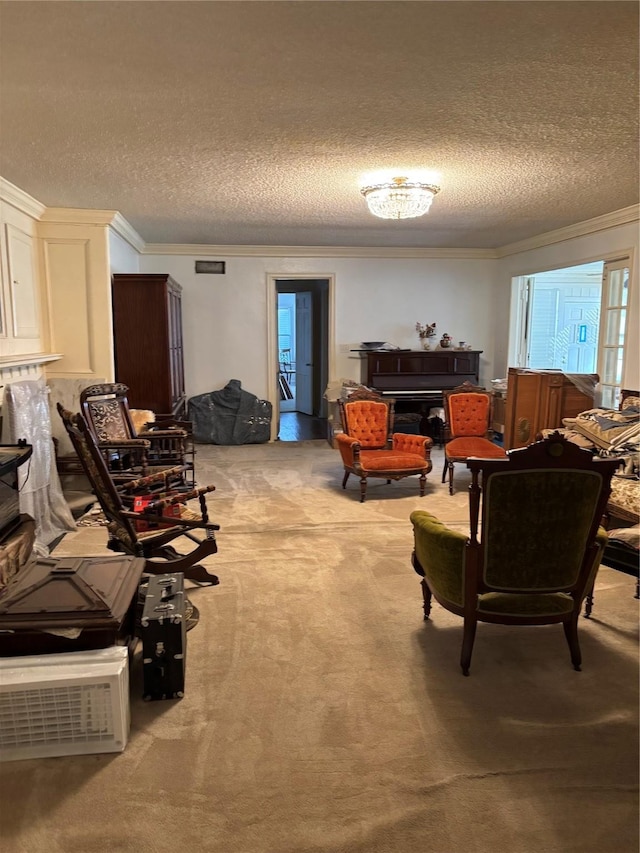 living room featuring a textured ceiling, a fireplace, crown molding, and light colored carpet