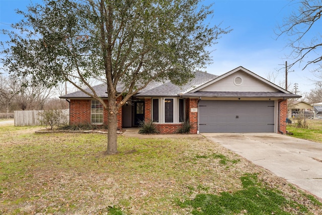 ranch-style house with driveway, an attached garage, fence, and brick siding