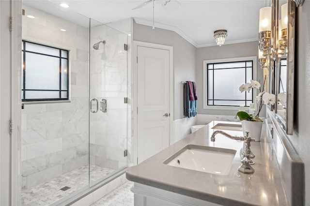 bathroom with double vanity, recessed lighting, ornamental molding, a stall shower, and a sink