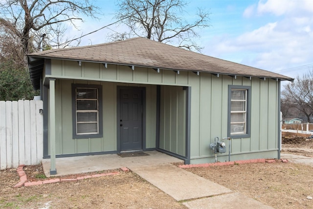 view of outbuilding with fence