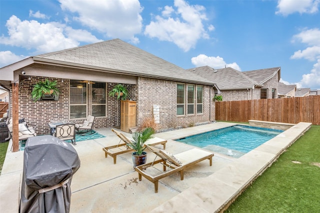 view of pool with a patio area, a grill, a fenced in pool, and a fenced backyard