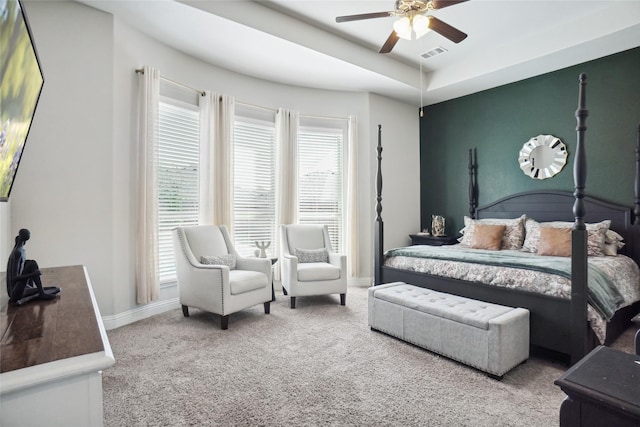 bedroom with carpet, visible vents, ceiling fan, and baseboards