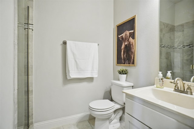 bathroom featuring baseboards, tiled shower, toilet, tile patterned flooring, and vanity