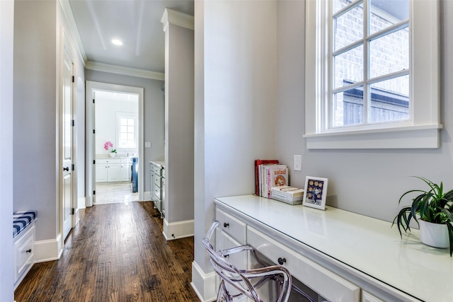 corridor featuring baseboards, recessed lighting, dark wood finished floors, and crown molding