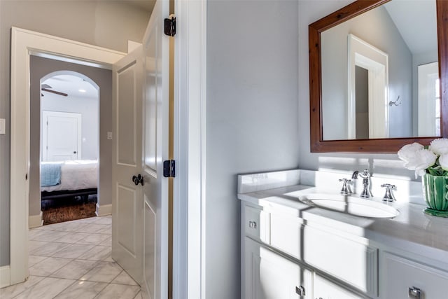 bathroom with ceiling fan and vanity