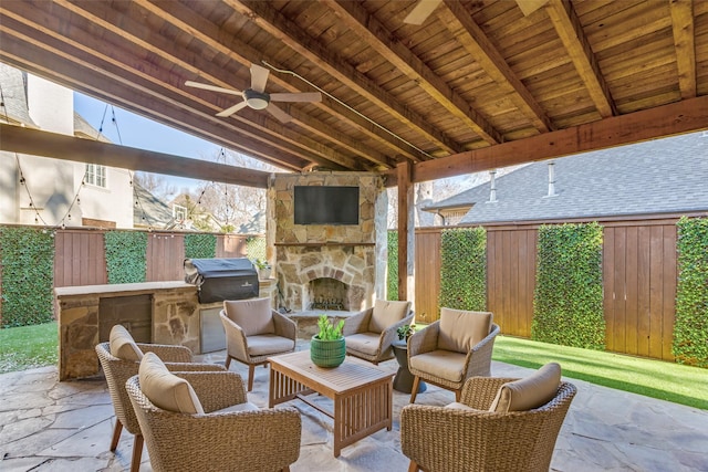 view of patio with a fenced backyard, ceiling fan, an outdoor living space with a fireplace, and area for grilling