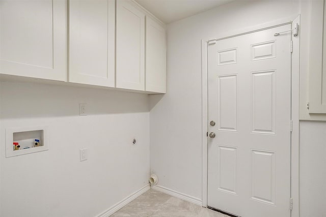 laundry room featuring hookup for an electric dryer, hookup for a washing machine, cabinet space, and baseboards