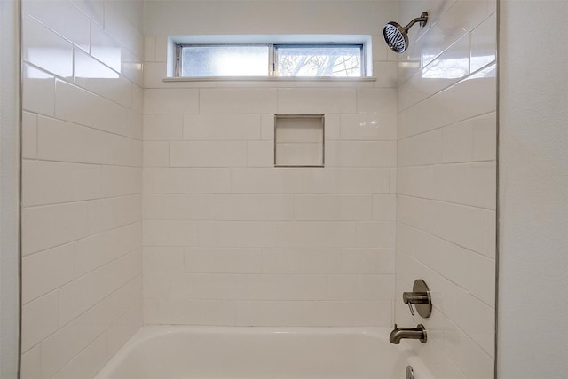 full bath featuring plenty of natural light and shower / tub combination