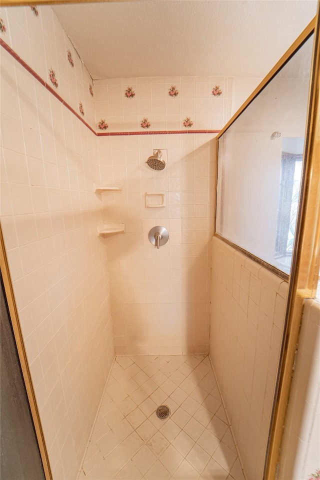 full bathroom with a shower stall