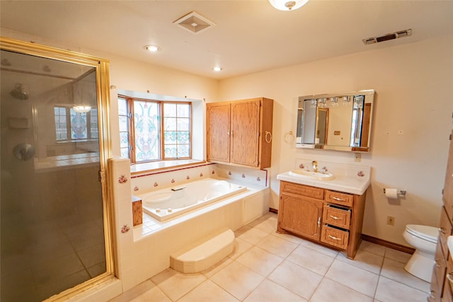 bathroom featuring a garden tub, a shower stall, visible vents, and vanity