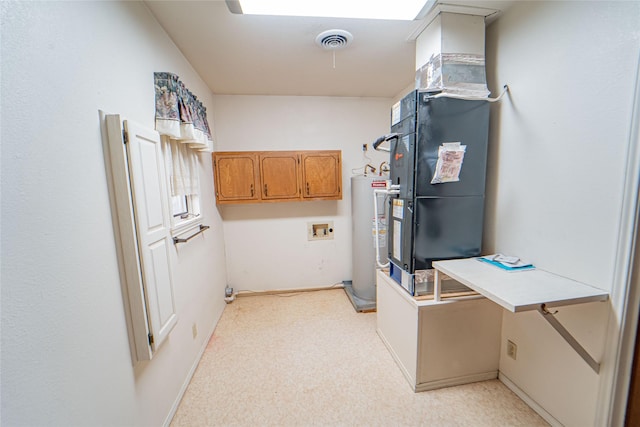 laundry area featuring electric water heater, washer hookup, and visible vents