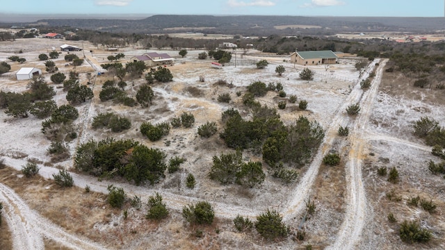 birds eye view of property with a rural view