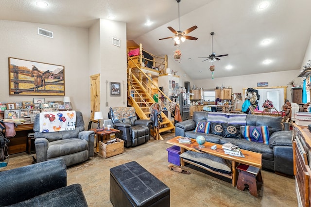 living area featuring high vaulted ceiling, recessed lighting, visible vents, and stairway