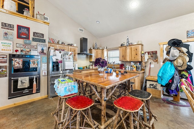 kitchen with visible vents, stainless steel fridge with ice dispenser, lofted ceiling, concrete flooring, and wall chimney range hood