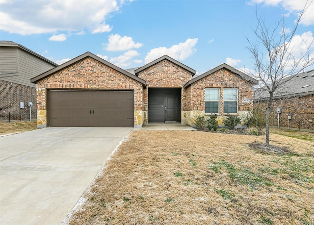 ranch-style house with a garage, stone siding, driveway, and brick siding