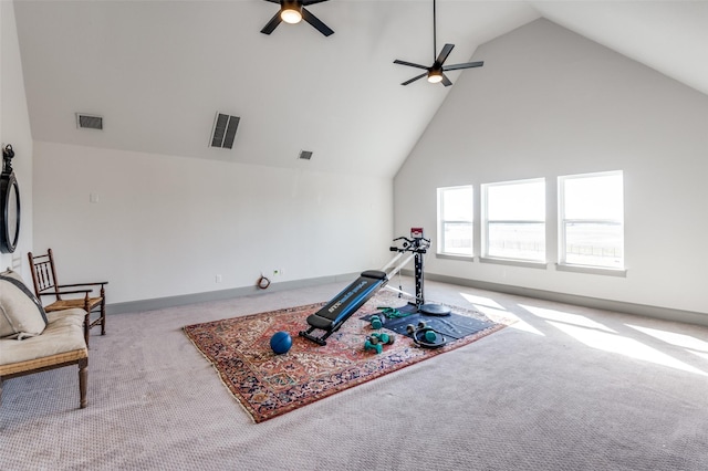 exercise room with light carpet, high vaulted ceiling, and visible vents