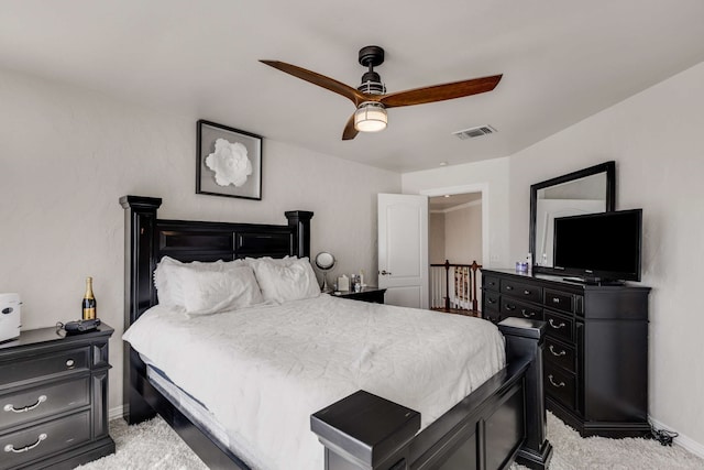 bedroom featuring light carpet, ceiling fan, visible vents, and baseboards