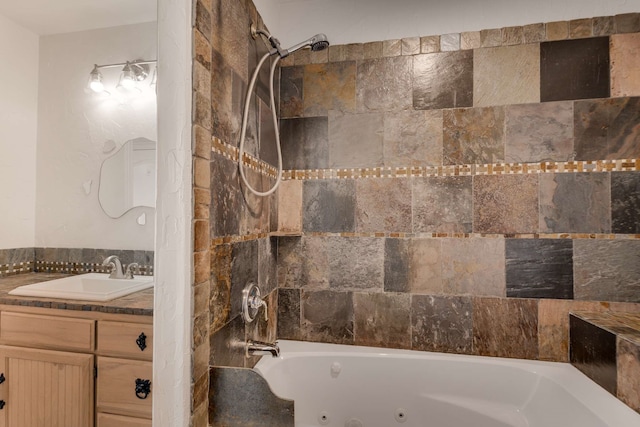 full bathroom featuring a combined bath / shower with jetted tub and vanity