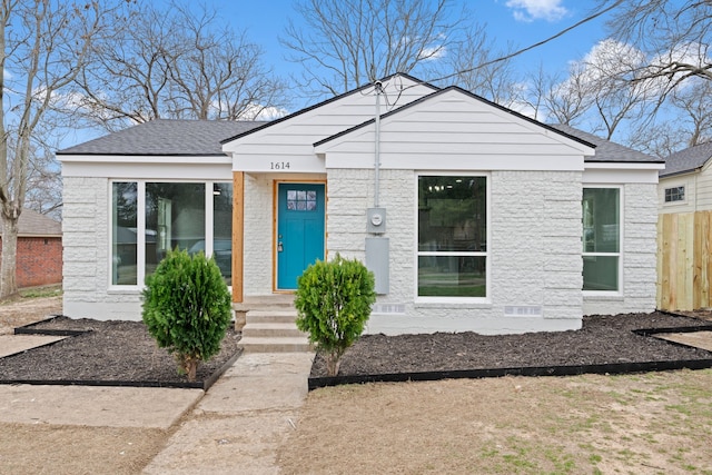 bungalow featuring crawl space and roof with shingles