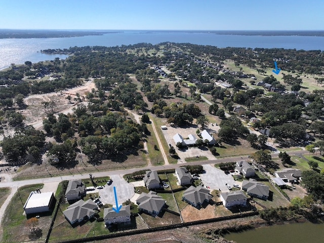 bird's eye view featuring a water view and a residential view