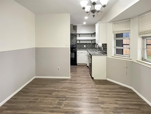 kitchen featuring backsplash, a sink, white cabinetry, open shelves, and stainless steel dishwasher