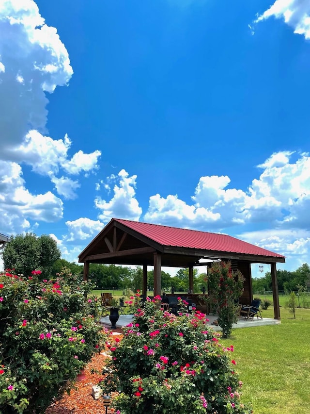 view of community with a patio area, a yard, and a gazebo