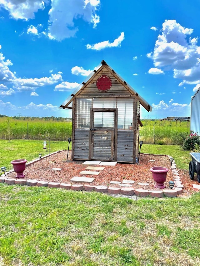 view of greenhouse featuring a yard