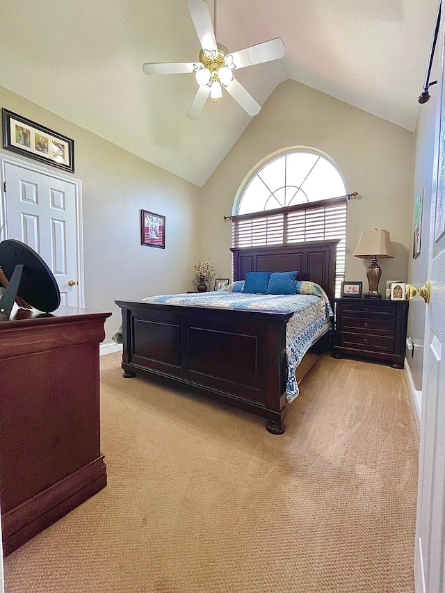 bedroom featuring a ceiling fan, lofted ceiling, light colored carpet, and baseboards
