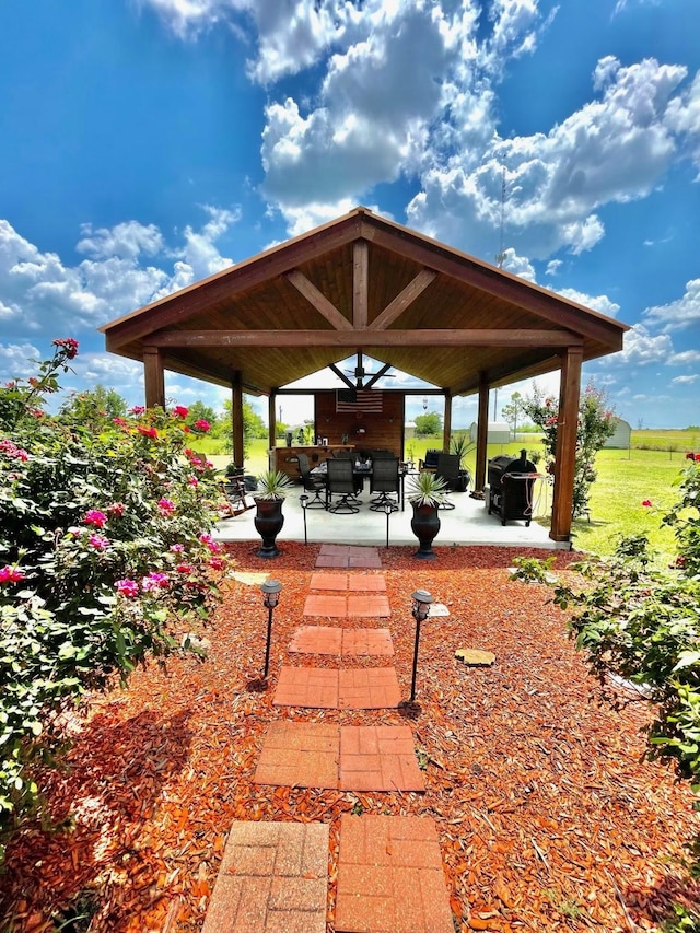 view of home's community with a gazebo and a patio