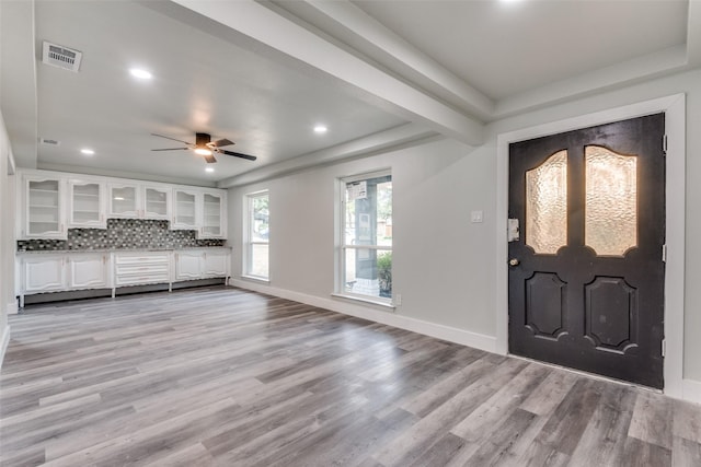 entryway with recessed lighting, visible vents, light wood-style flooring, and baseboards