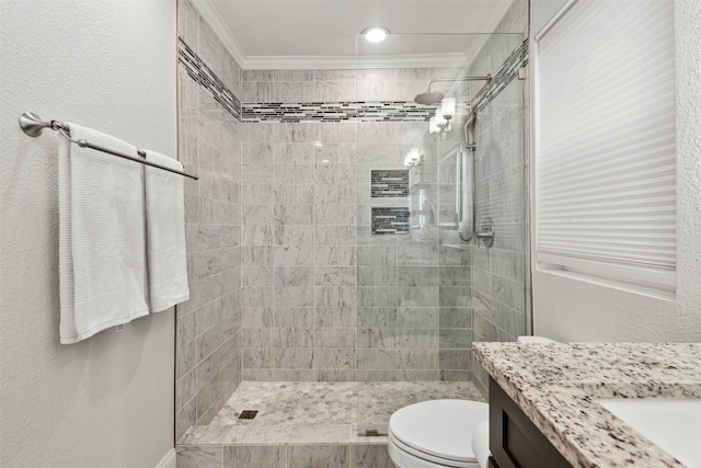 bathroom with toilet, ornamental molding, a walk in shower, and vanity