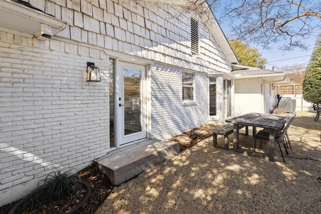 exterior space with brick siding