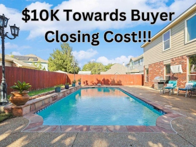 view of swimming pool with a fenced in pool, a patio, and a fenced backyard