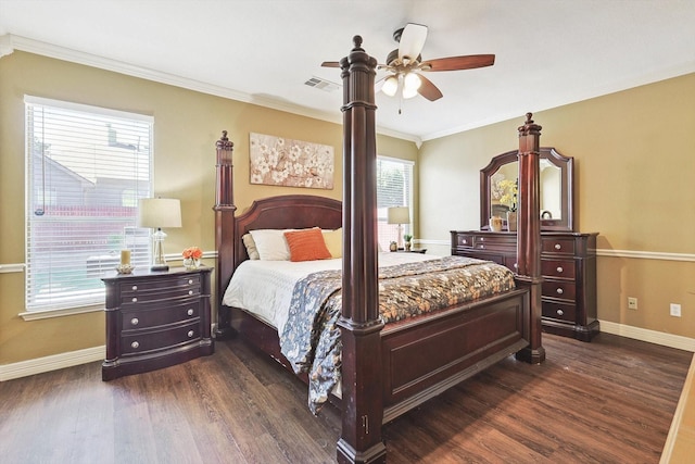 bedroom with visible vents, dark wood-type flooring, ornamental molding, ceiling fan, and baseboards