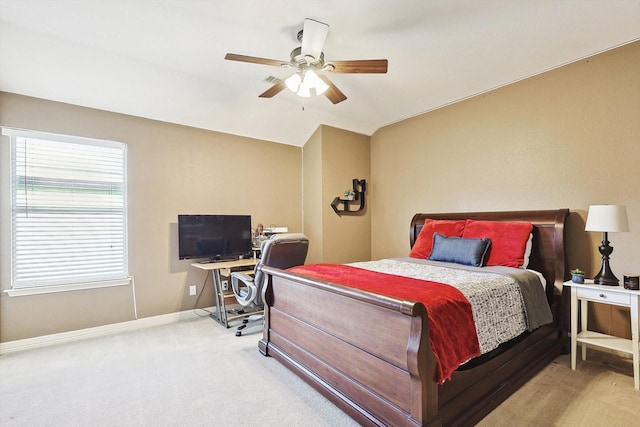 bedroom with carpet floors, baseboards, a ceiling fan, and lofted ceiling