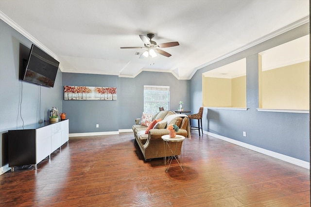 sitting room featuring ornamental molding, dark wood-style flooring, and baseboards