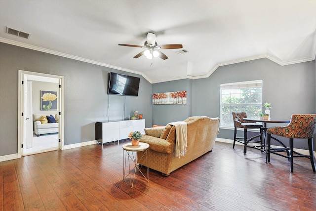 living area featuring dark wood-style floors, ornamental molding, and visible vents