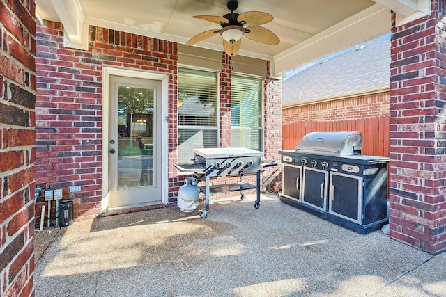 exterior space featuring a ceiling fan, a grill, and fence