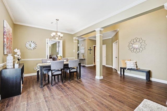 dining area featuring a notable chandelier, dark wood-type flooring, decorative columns, and baseboards