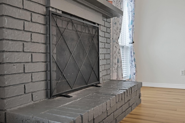 room details with baseboards and wood finished floors