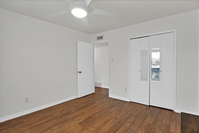 unfurnished bedroom with a ceiling fan, baseboards, visible vents, and dark wood-style flooring