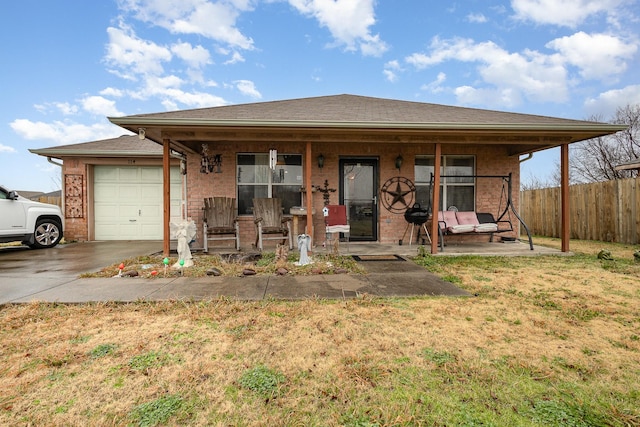 bungalow-style home featuring covered porch, a garage, brick siding, fence, and concrete driveway