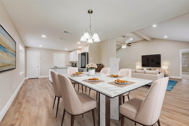 dining area with light wood-type flooring, baseboards, lofted ceiling with beams, and visible vents