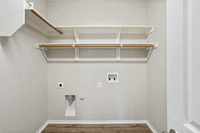 laundry room featuring gas dryer hookup, hookup for a washing machine, hookup for an electric dryer, laundry area, and dark wood finished floors