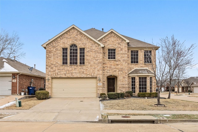 view of front of home with a garage, concrete driveway, brick siding, and roof with shingles