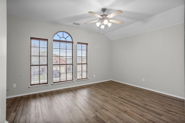 unfurnished room featuring baseboards, visible vents, ceiling fan, and dark wood-style flooring